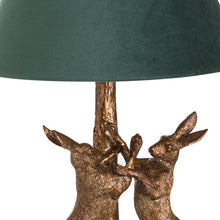 Load image into Gallery viewer, Antique Gold Marching Hares Lamp With Green Velvet Shade
