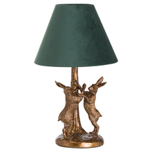 Load image into Gallery viewer, Antique Gold Marching Hares Lamp With Green Velvet Shade
